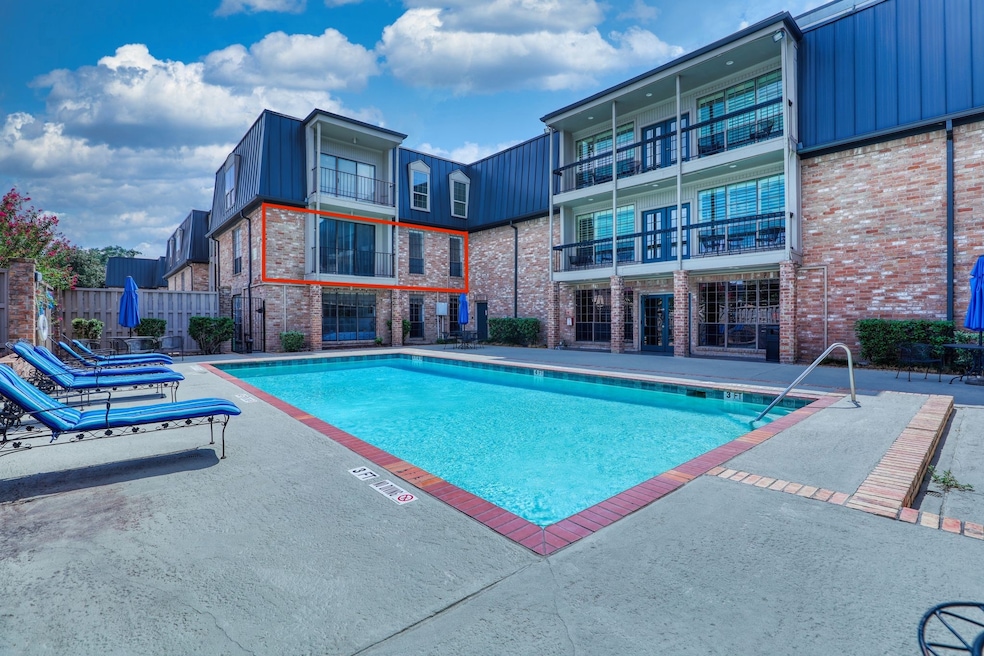 This inviting second floor unit overlooks the pool