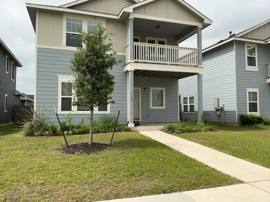 View of front of property with a balcony, board a