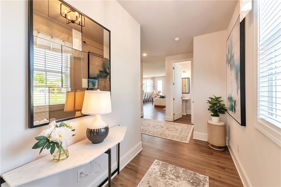 The inviting foyer sets the tone for the home with its bright, open design and elegant finishes.