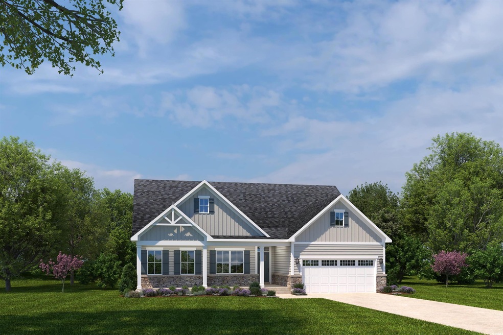 Craftsman-style home featuring a front lawn, stone