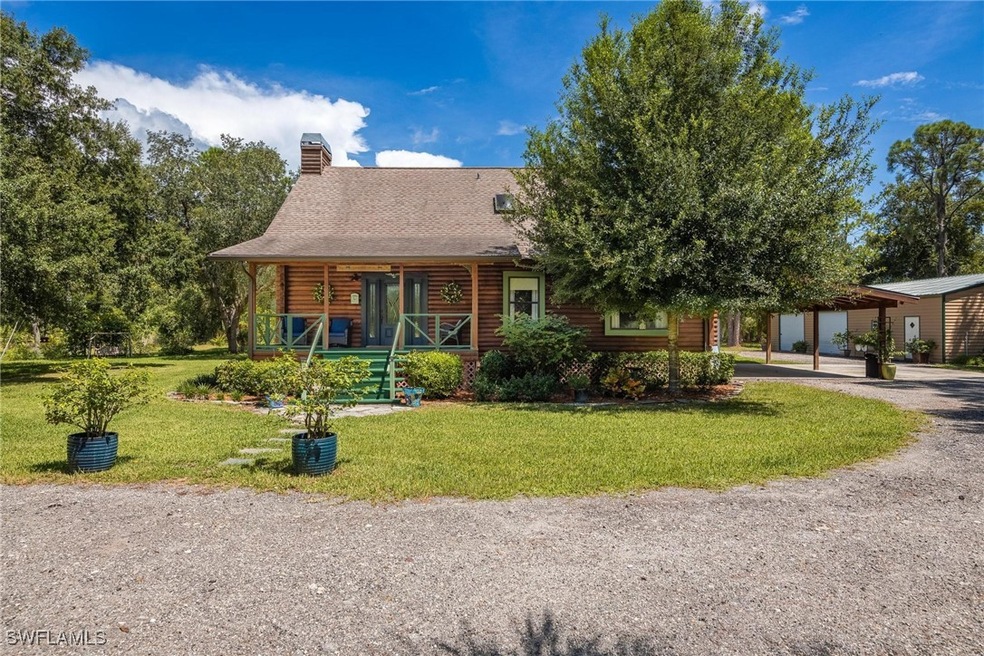 Cypress log home featuring 5 acres, large front po
