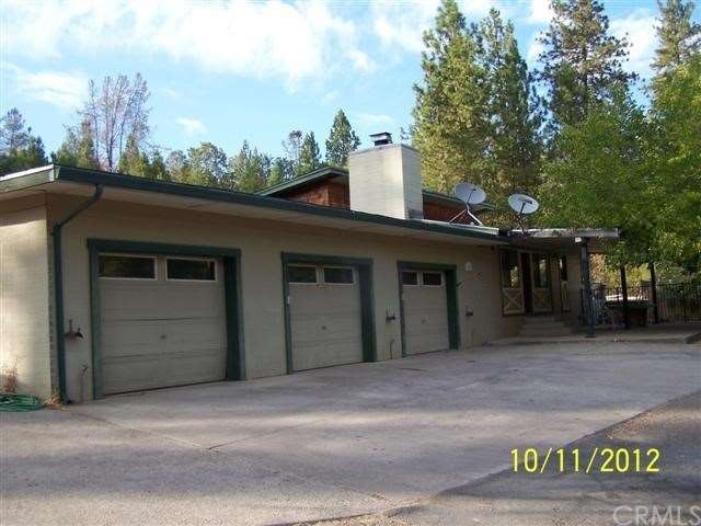 Front of home w/three-car garage.