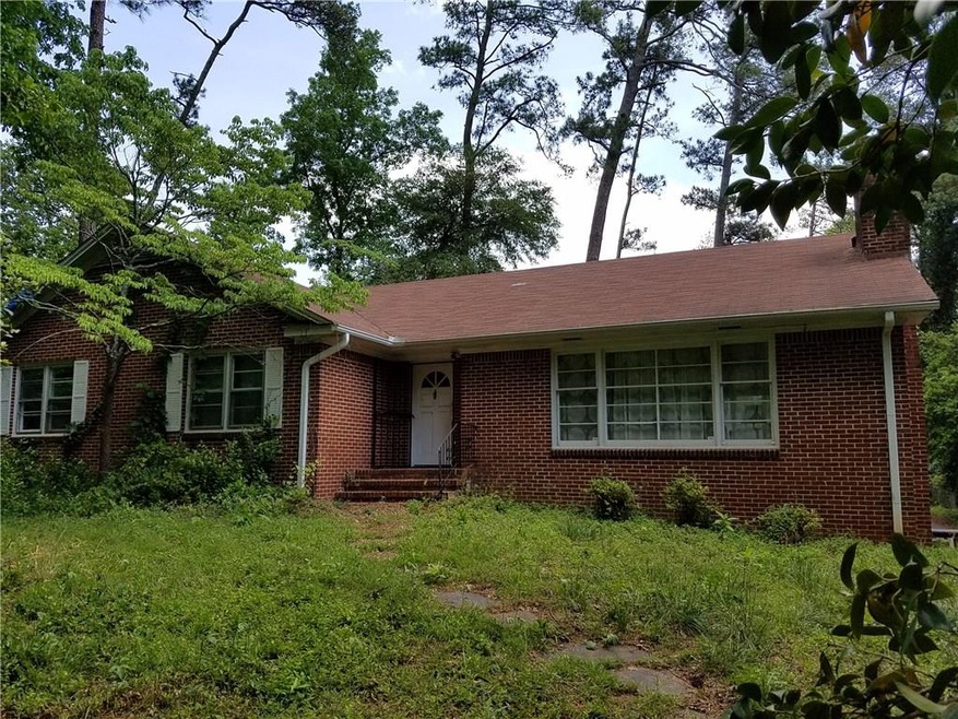 Large brick ranch set way back from the street, so