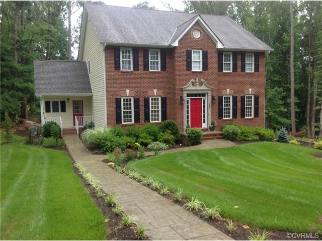 Front walk leads to a handsome Front Door Entry, a