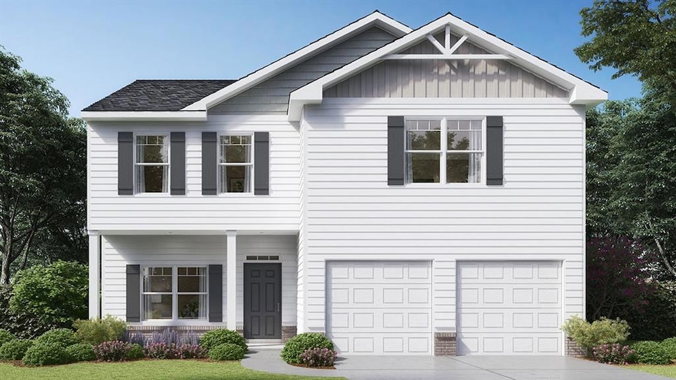 View of front of home with a garage and a front la