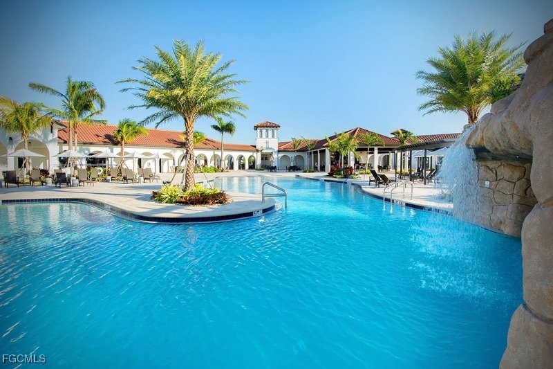View of swimming pool featuring a patio area