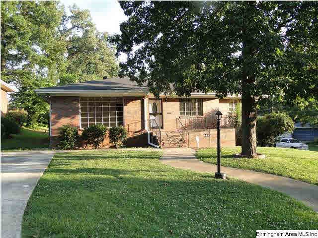 Full brick home with parking on the both the main 