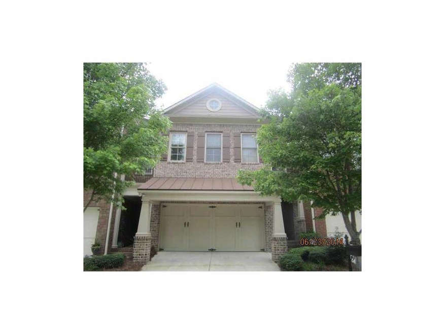 Exterior Front. Entry door on right of garage is r
