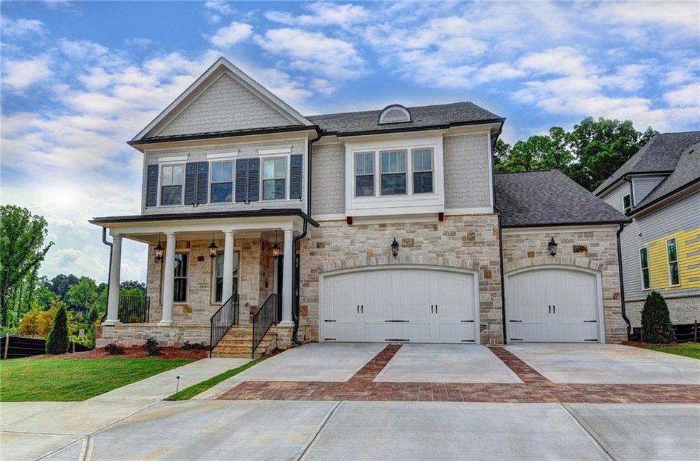 This home features a beautiful stone front porch.