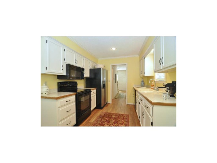 Newer appliances, wood floors, crown molding.
