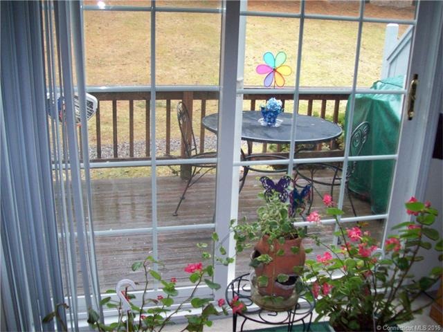 VIEW FROM LIVING ROOM TO DECK THRU NEW SLIDER.