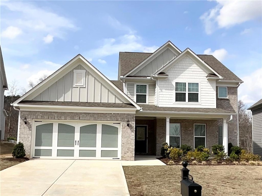Craftsman inspired home with an attached garage, b