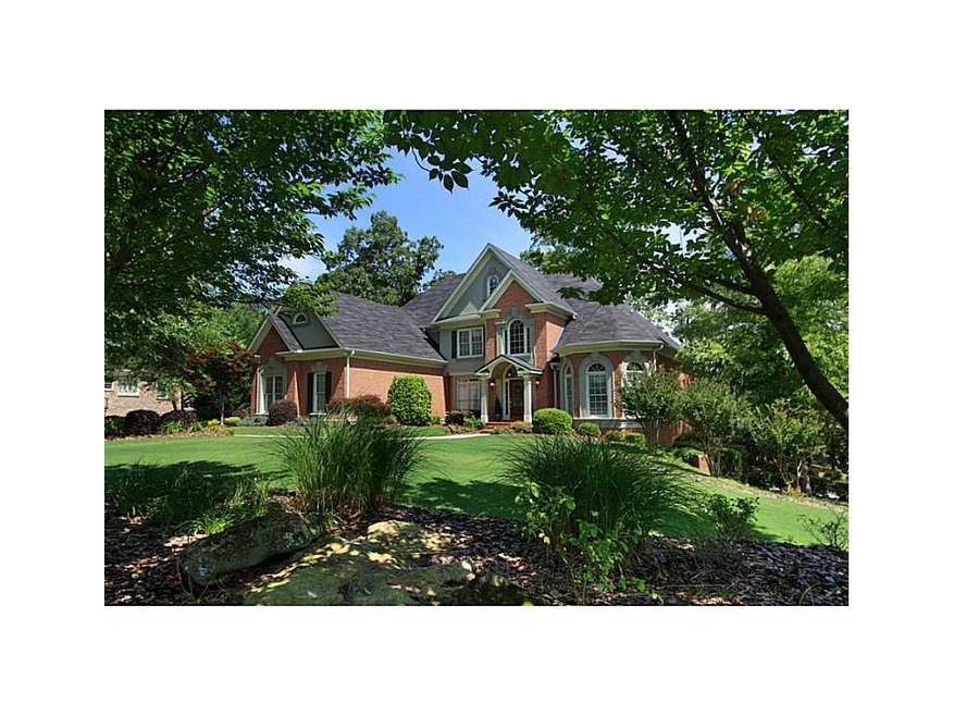 Exterior Front. Professional landscaping surrounds