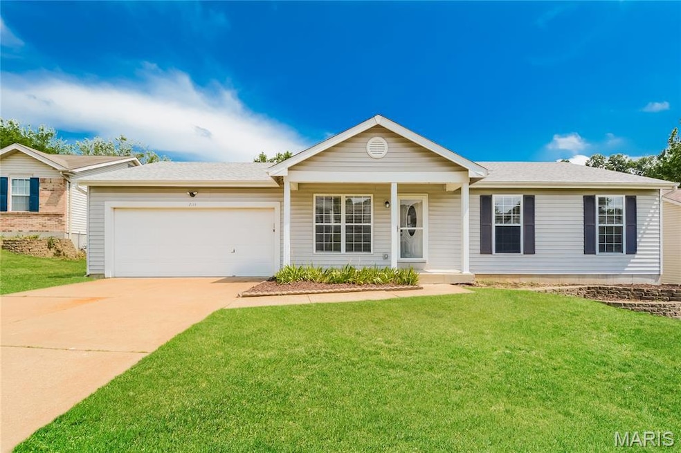 Ranch-style home featuring covered porch, roof with shingles, driveway, and a front lawn