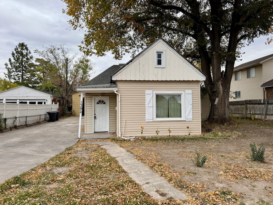 Bungalow-style home featuring a shingled roof and board and batten siding