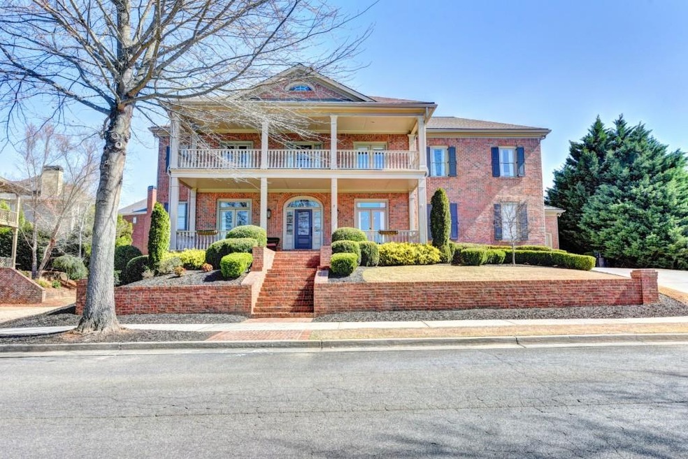 Double front porch overlooks 80 acre meadow and ha