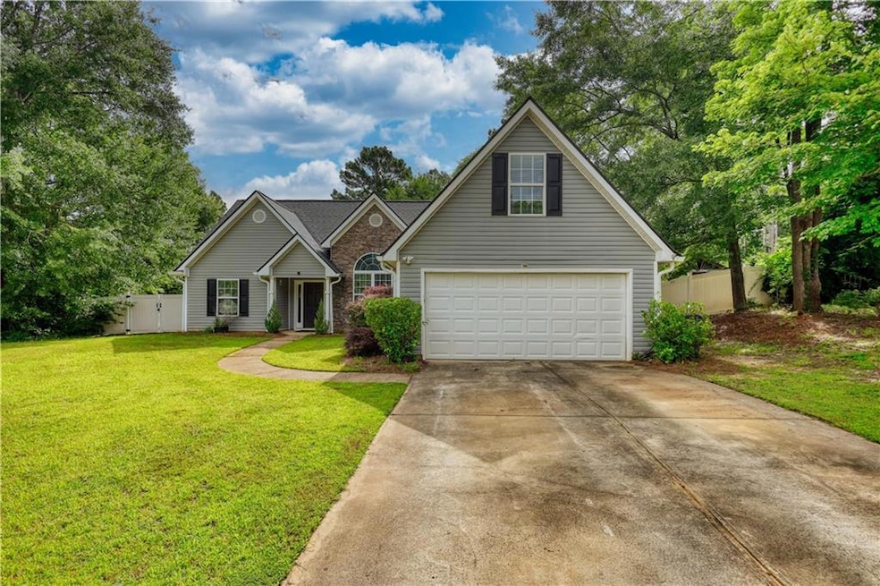 Traditional-style home with concrete driveway and an attached garage