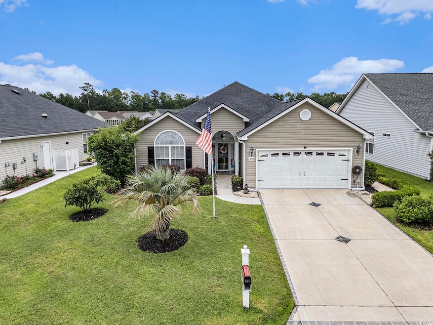 View of front of home featuring a garage, driveway, a front lawn, and roof with shingles
