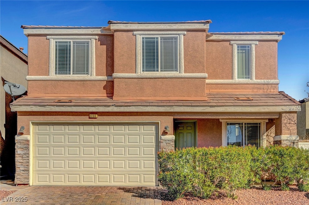 View of front facade featuring an attached garage,