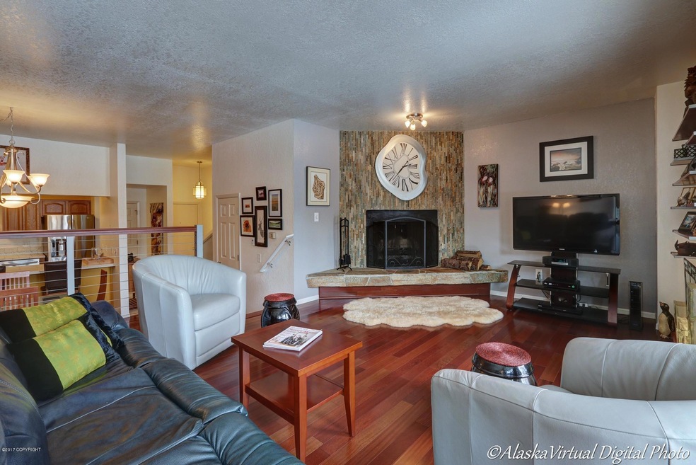 STONE FIREPLACE, GLEAMING FLOORS