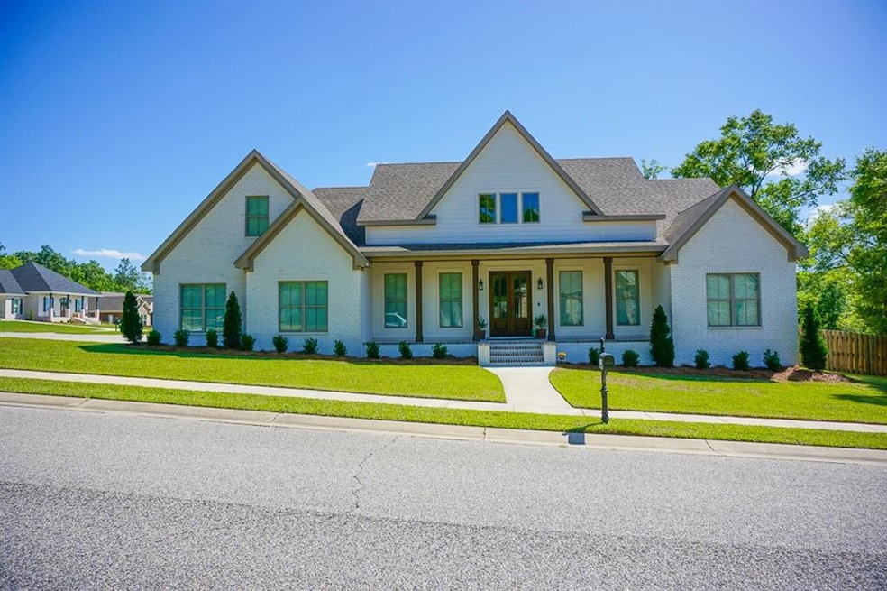 Modern inspired farmhouse featuring brick siding, 