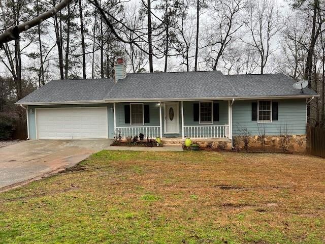 Ranch-style house with a front lawn, a porch, and 