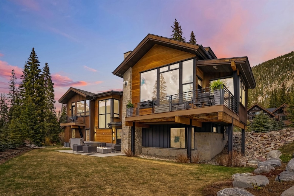 Home at dusk with two decks, patio hot tub and irr