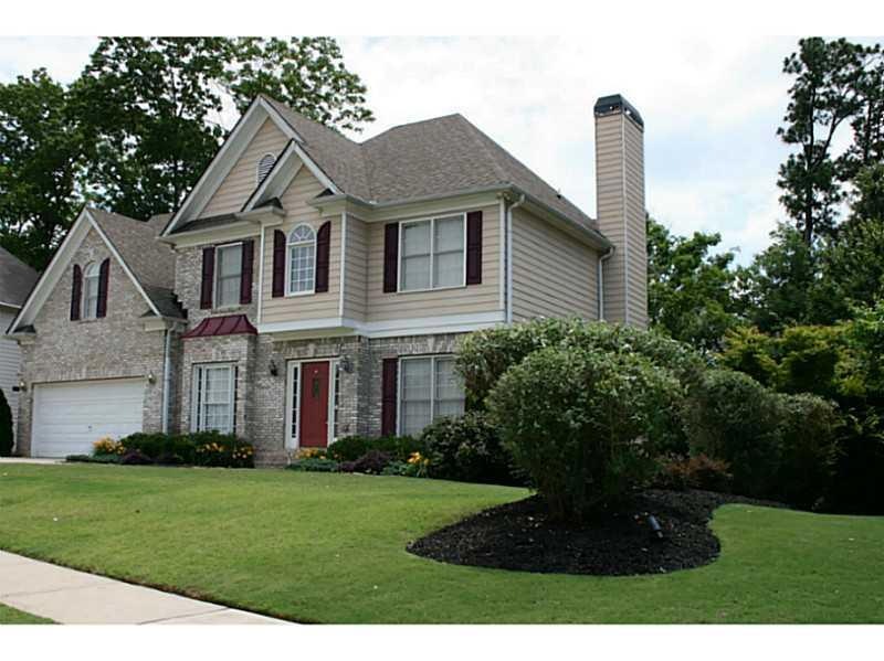 Exterior Front. The yard is beautifully landscaped