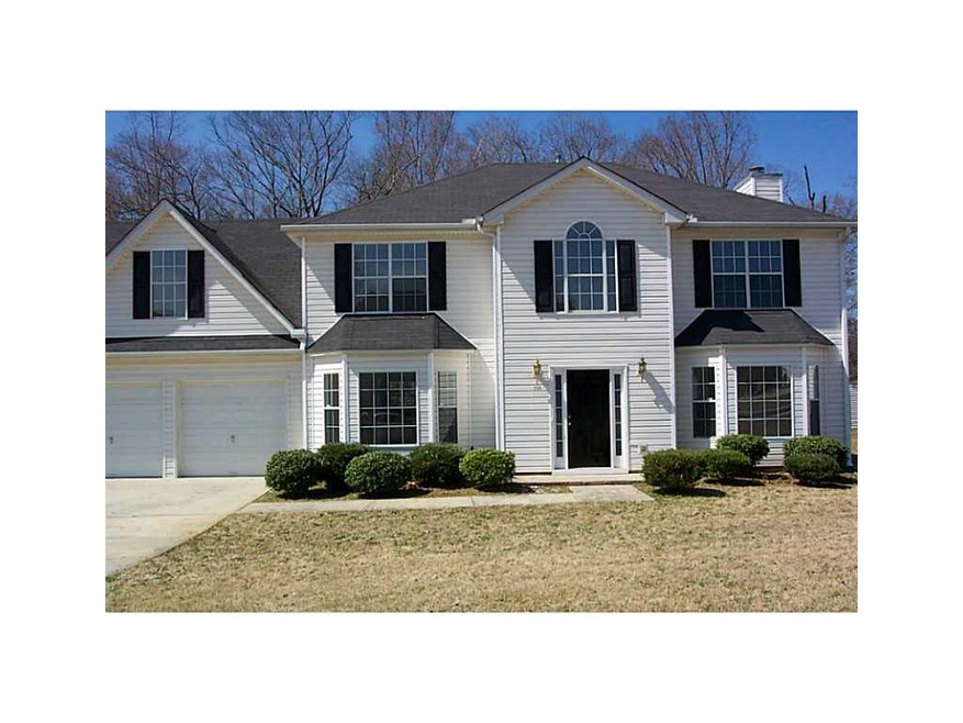 Exterior Front. beautiful home with bay windows