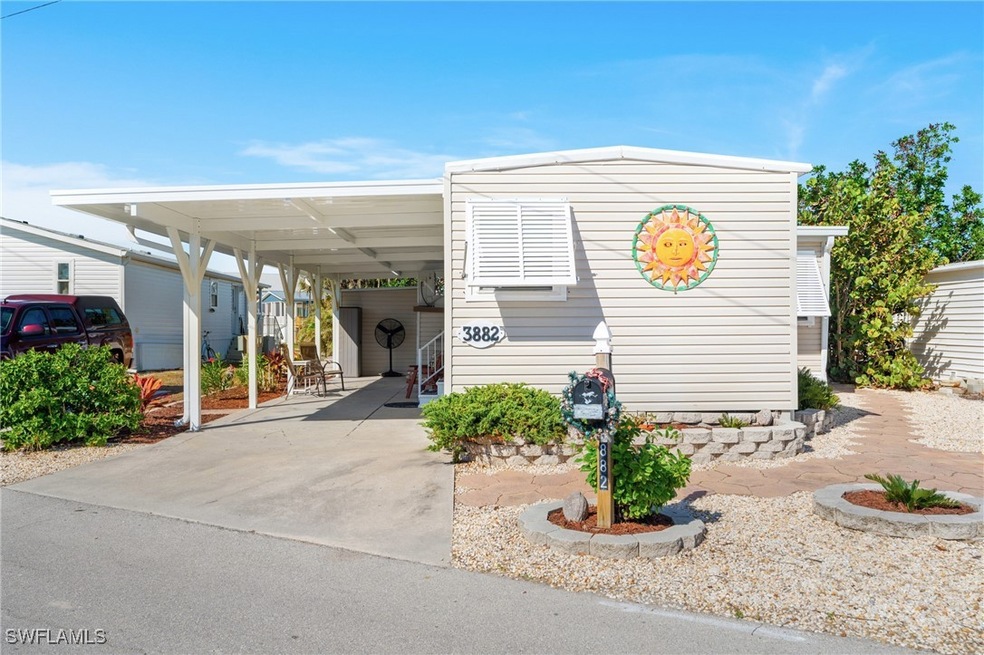 Beautifully landscaped home with carport