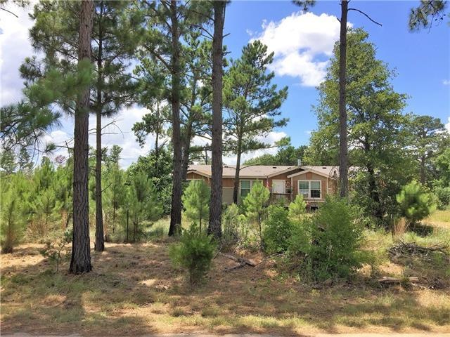 The home is nestled in the pines.