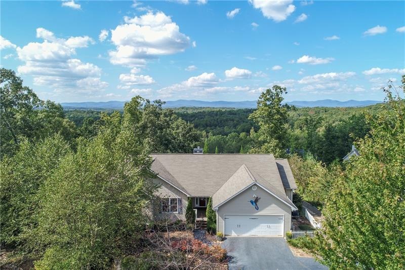 Unobstructed mountain and garden views from inside and outside of this move-in ready ranch with wheelchair accessible apartment located just minutes to Historic Dahlonega, GA 400, and Dawsonville.