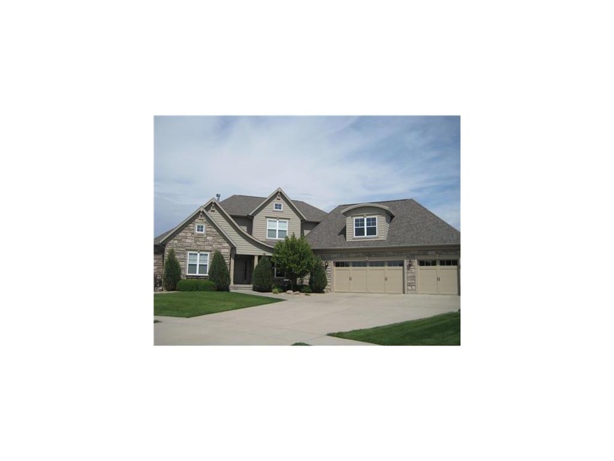 Front Exterior. STONE & VINYL EXTERIOR WITH CARRIA