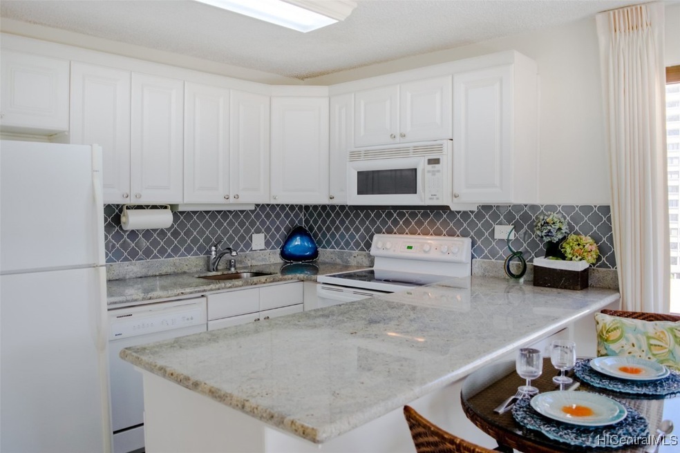Functional kitchen with granite counter tops.