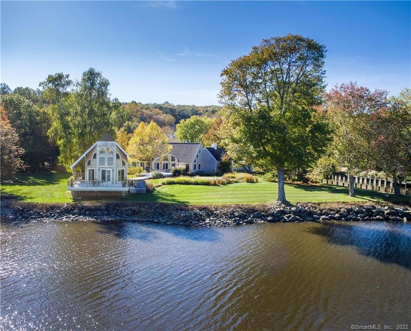 View from River of boat house and main house