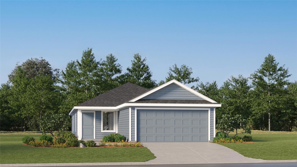 Ranch-style home featuring a garage and a front ya