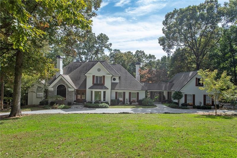 Classic French Country Farmhouse nestled among 3 p