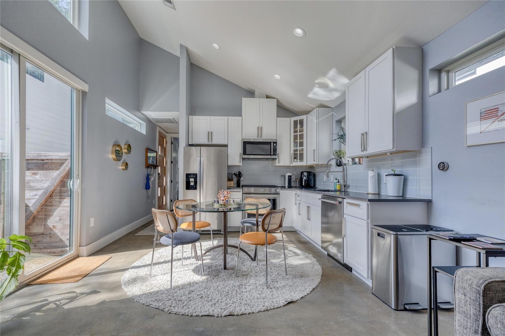 Kitchen featuring appliances with stainless steel