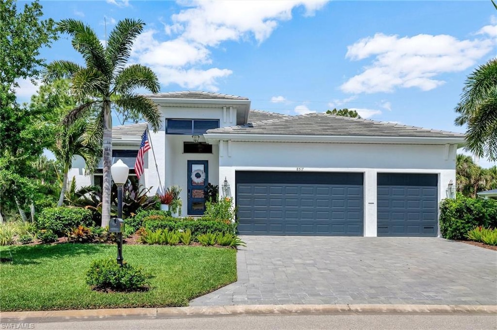 View of front of house featuring stucco siding, an