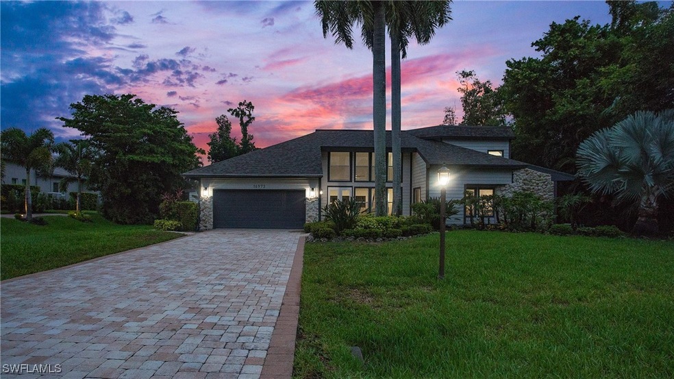 View of front of property featuring stone siding,