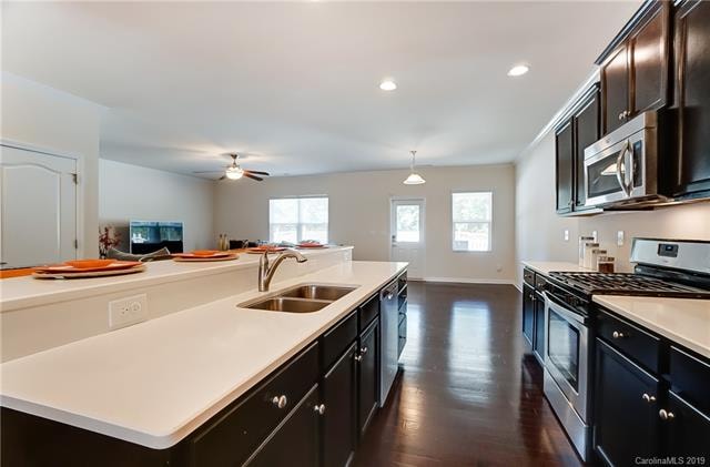 Elegant kitchen with quartz counter tops, island a