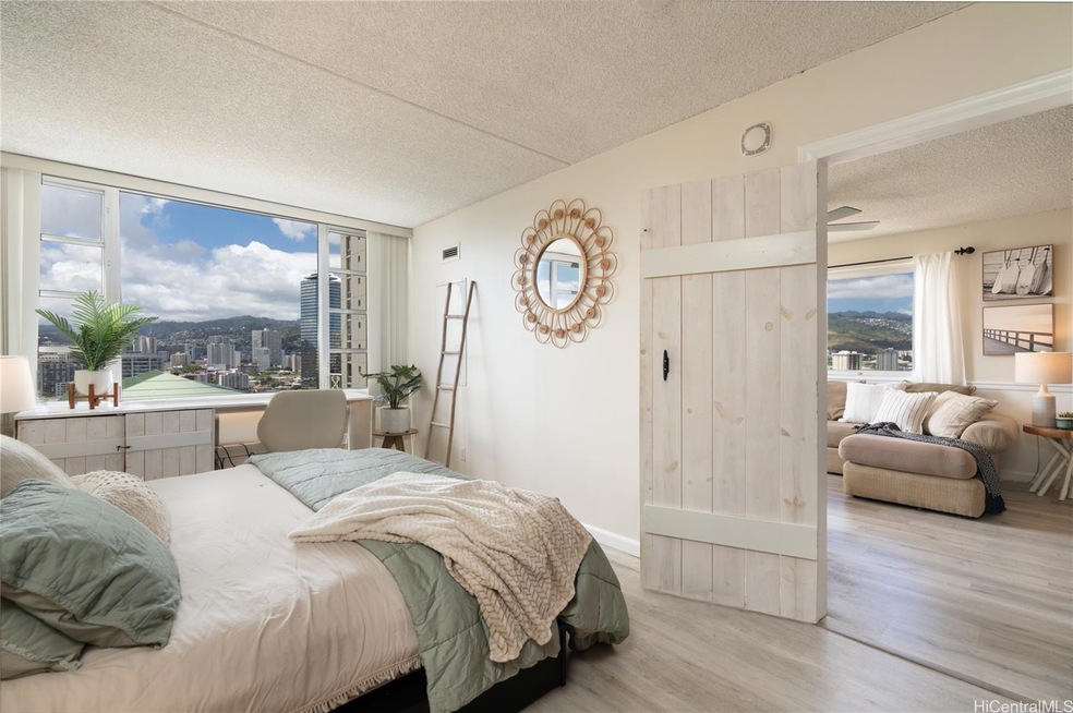 Spacious bedroom that looks into the bright living