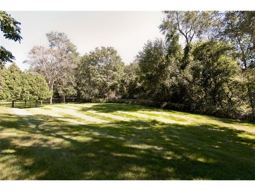 Fenced, wooded, private 1.3 acre lot with county t
