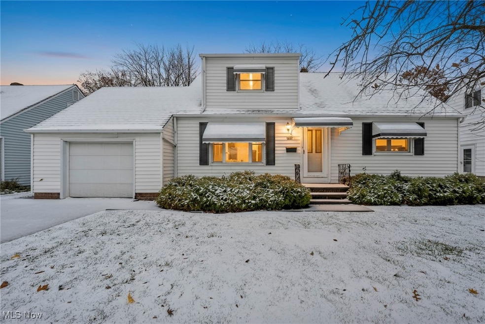 View of front of property featuring a garage