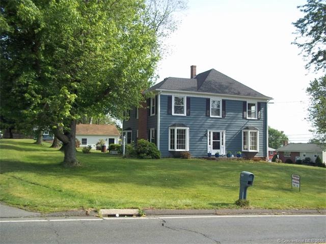FRONT SOUTH FACING VIEW, TWO CAR GARAGE VISABLE IN