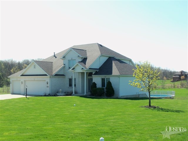 Front View of Home on acreage with Above Ground Po