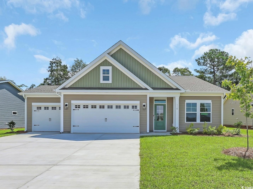 View of front of house featuring board and batten siding, concrete driveway, a front lawn, an attached garage, and a shingled roof