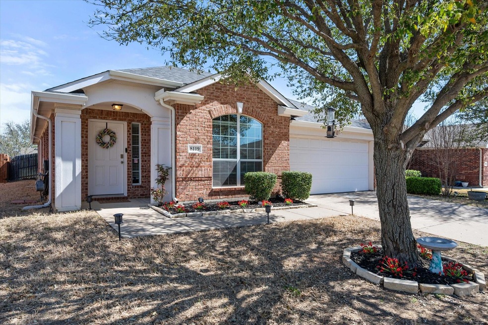 Ranch-style house featuring brick siding, driveway