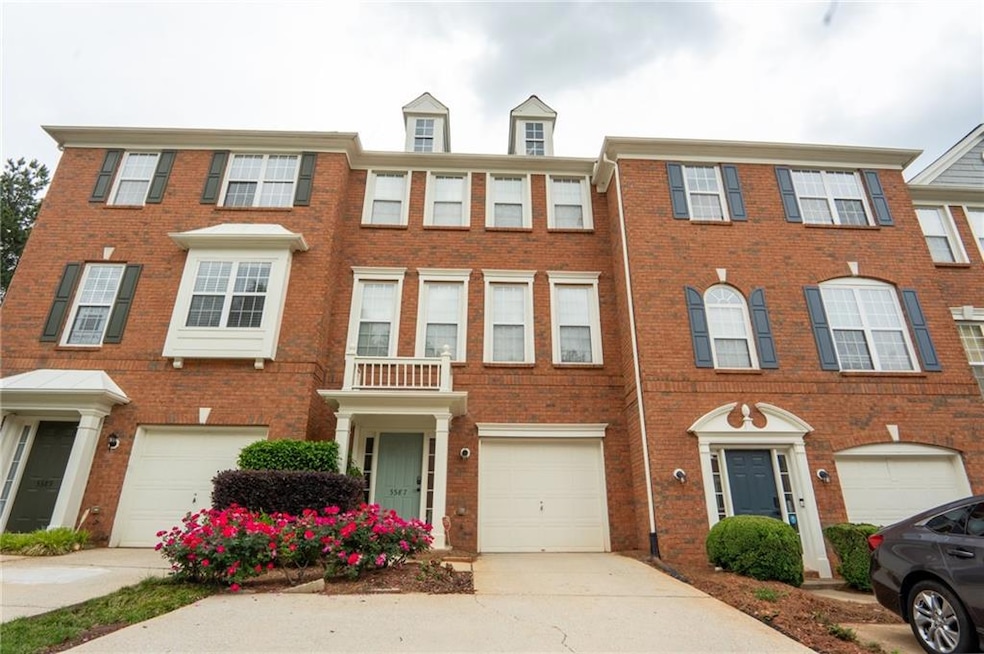 Multi unit property with brick siding, driveway, a