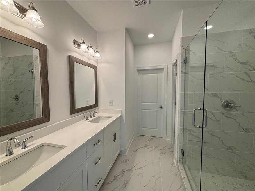 Double vanities with a huge walk in shower!